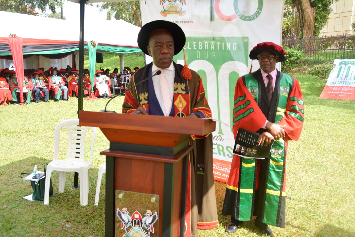 The Ag. Deputy Vice Chancellor (Finance & Administration) and Principal CEDAT, Prof. Henry Alinaitwe (L) presents candidates for the conferment of degrees and other awards for excellent performance during the Fifth and Final Session of Makerere University's 72nd Graduation Ceremony on 27th May 2022. Right is Dr. Allan Birabi, Graduation Emcee and CEDAT Member of Staff.