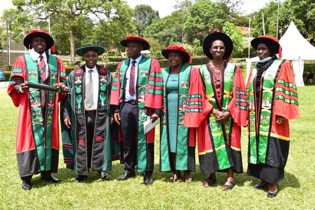 The CoNAS Leadership poses with one of the PhD Graduands, Dr. Godwin Anywar (L)