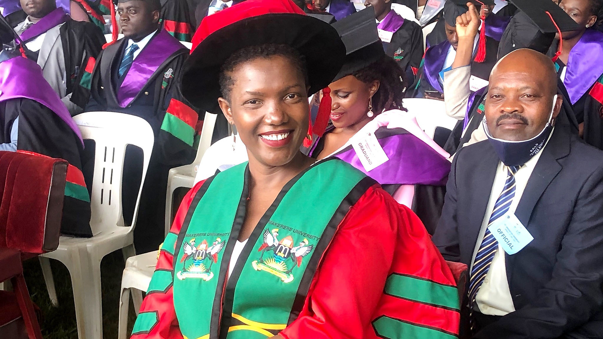 Dr. Caroline Adoch, the first female recipient of the Doctor of Laws (LL.D) of Makerere University smiles for the camera during Day 1 of the 72nd Graduation Ceremony on 23rd May 2022.