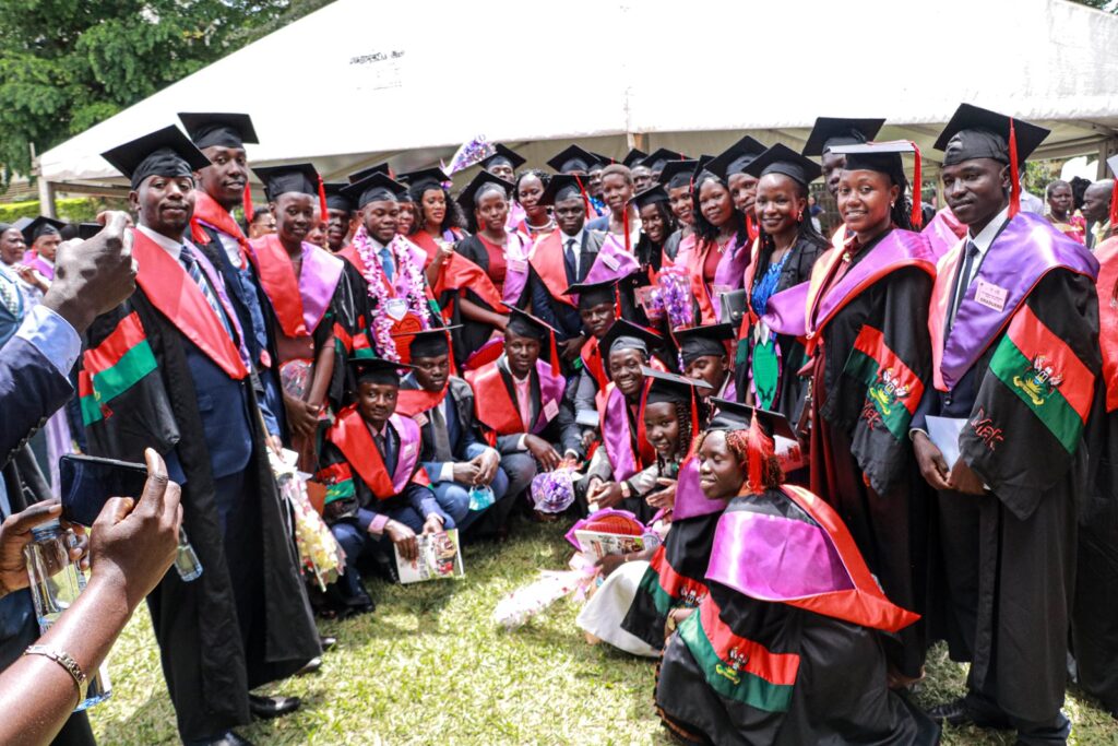 Some of the graduands of BEHS programme in a group photo with the Principal Registrar of MakSPH Ms. Gladys Khamili shortly after graduation.