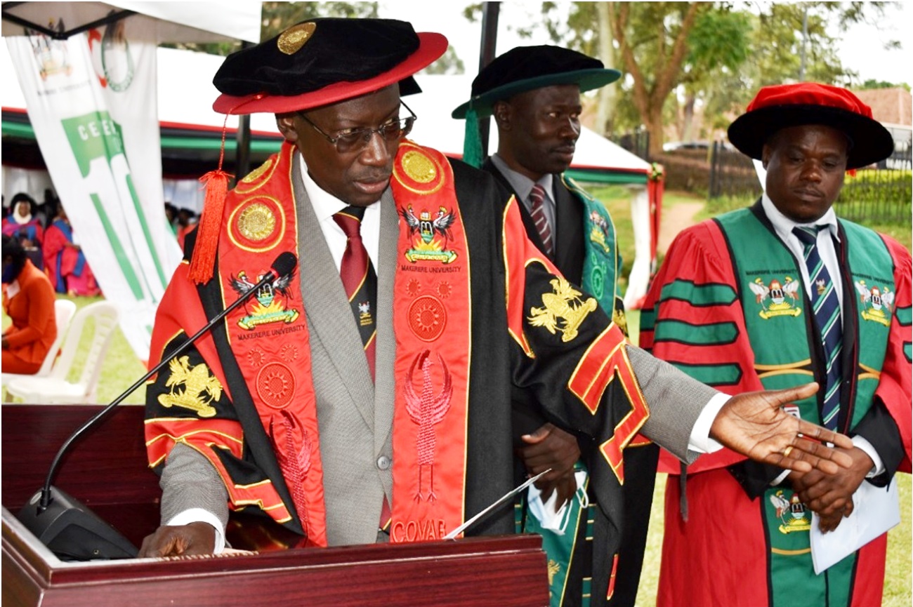 CoVAB Principal Prof. Frank Norbert Mwiine (R) , Deputy Principal Prof. James Okwee Acai (C) and Prof. Lawrence Mugisha present the best BVM students for the award during the Third Session of Makerere University's 72nd Graduation Ceremony on 25th May 2022.