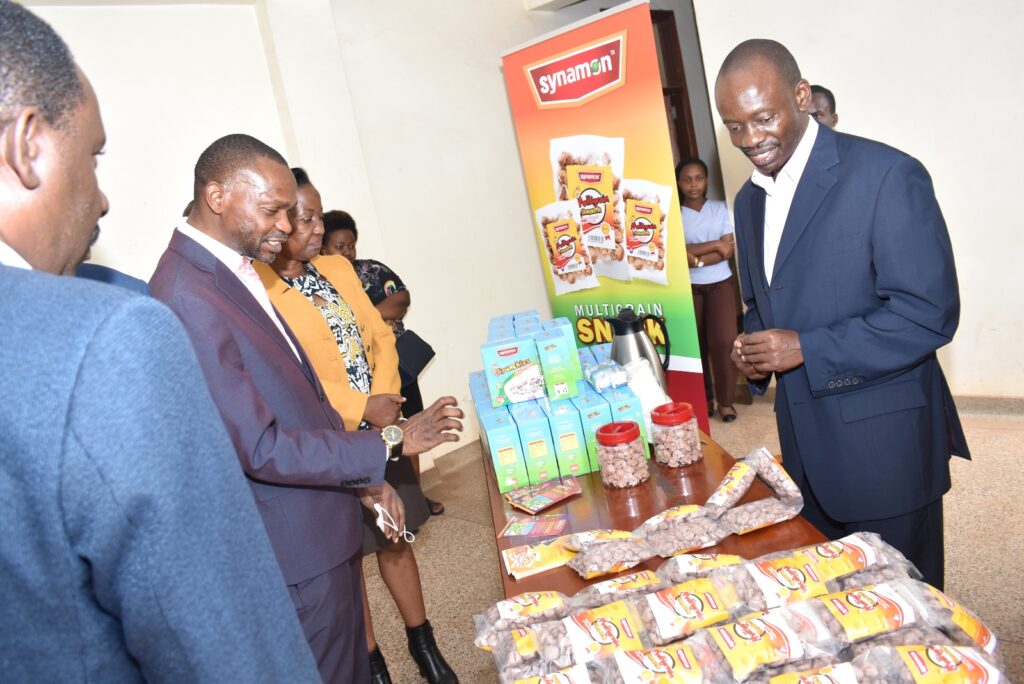 The DVCAA, Prof. Umar Kakumba (2nd L) checking out some of the products developed under the project.