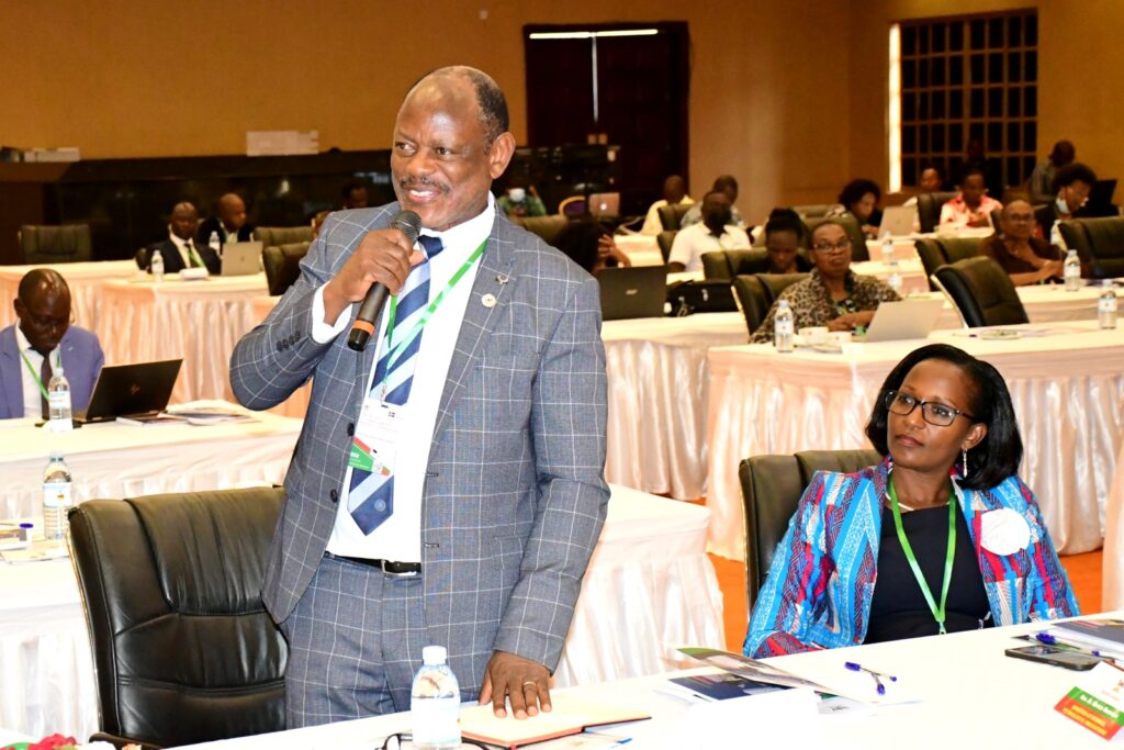 The Vice Chancellor, Prof. Barnabas Nawangwe (L) contributes to the discussion as the Chairperson of Council, Mrs. Lorna Magara (R) listens. 