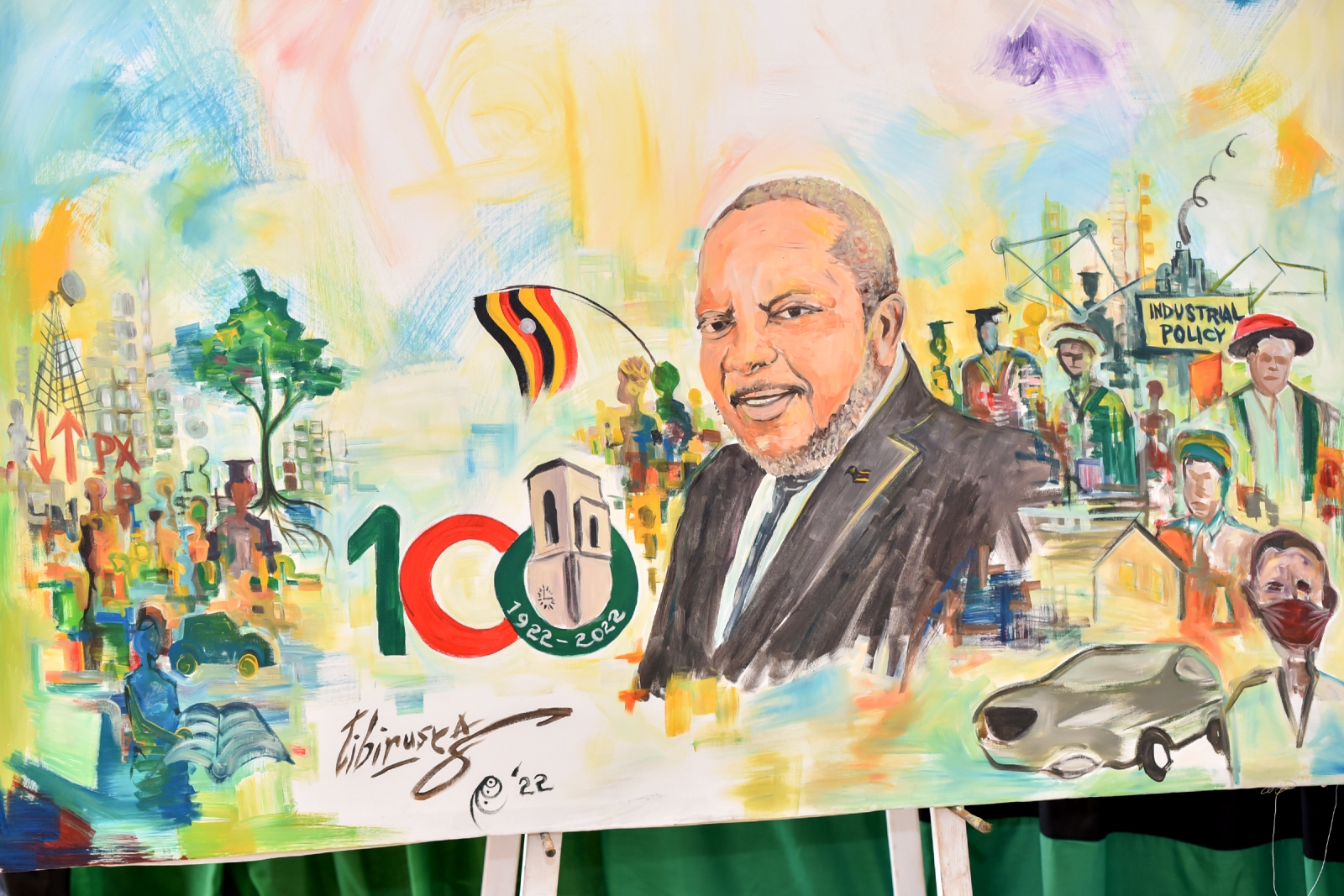 A live painting by "Artivist" Tibirusya Roland (@Tibirusya1) of proceedings at the Second of the Makerere@100 Lecture Series and Inaugural Tumusiime Mutebile Memorial Lecture held 28th April 2022 in the CTF2 Auditorium, Makerere University.