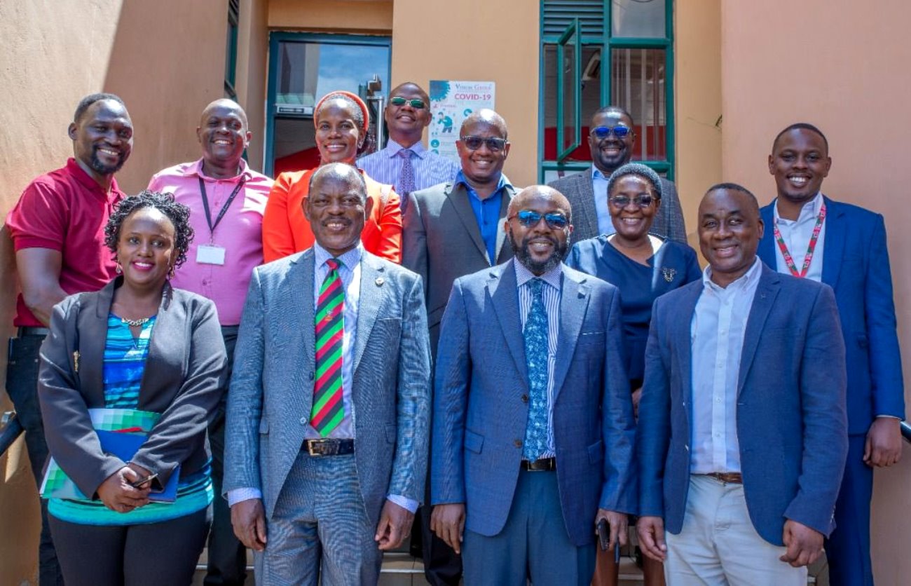 Front Row: The Vice Chancellor, Prof. Barnabas Nawangwe (2nd L), Vision Group CEO, Mr. Don Wanyama (2nd R) and Head Mak@100 Secretariat, Mr. Awel Uwihanganye (R) with Mak and Vision Group Staff after the Agreement Signing Ceremony on 12th May 2022, First Street, Industrial Area, Kampala.