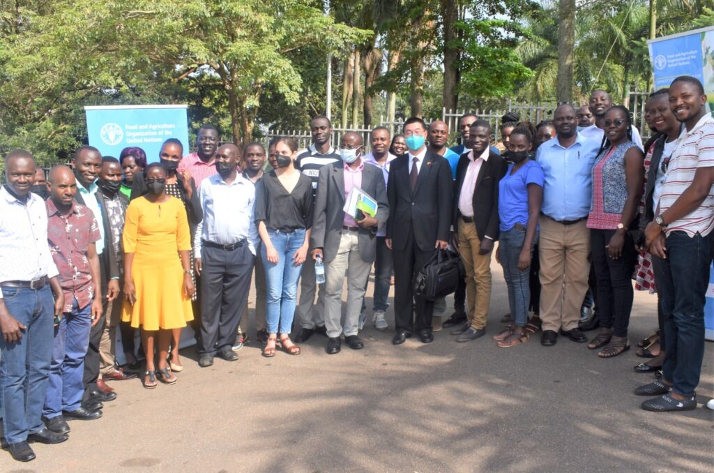Participants in a group photo with the First Secretary, Embassy of China in Uganda, Mr Chenxu Wang (6th R) and the representative of the Principal of CAES, Prof. Fred Kabi (7th R) at the end of the training.