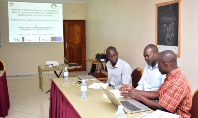 The project team, Dr. Robinson Odong (C), Dr. Peter Akoll (R) and Mr. John Omara (L) share notes shortly before the stakeholders meeting in Mbarara City on 31st May 2022.