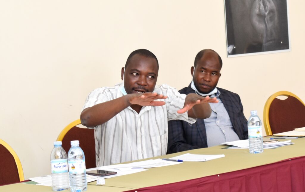 Mr Ayebare Calist (R), Fisheries Officer, Isingiro District and Mr Katongole Joseph, a farmer in Mbarara District at the stakeholders meeting