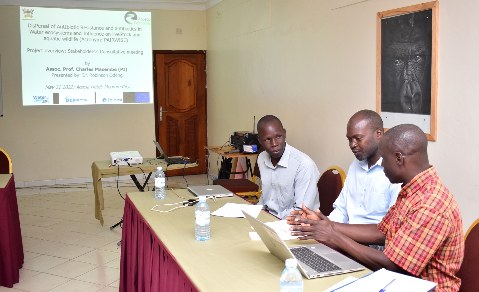 The project team, Dr. Robinson Odong (C), Dr. Peter Akoll (R) and Mr. John Omara (L) share notes shortly before the stakeholders meeting in Mbarara City on 31st May 2022.