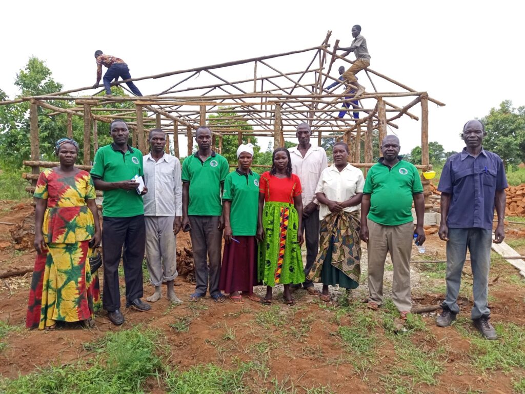 Productivity Assistants for the Dairy value chain pose for a photo at the dairy facility demonstration site which is under construction in Kaberekeke on 20th May, 2022.