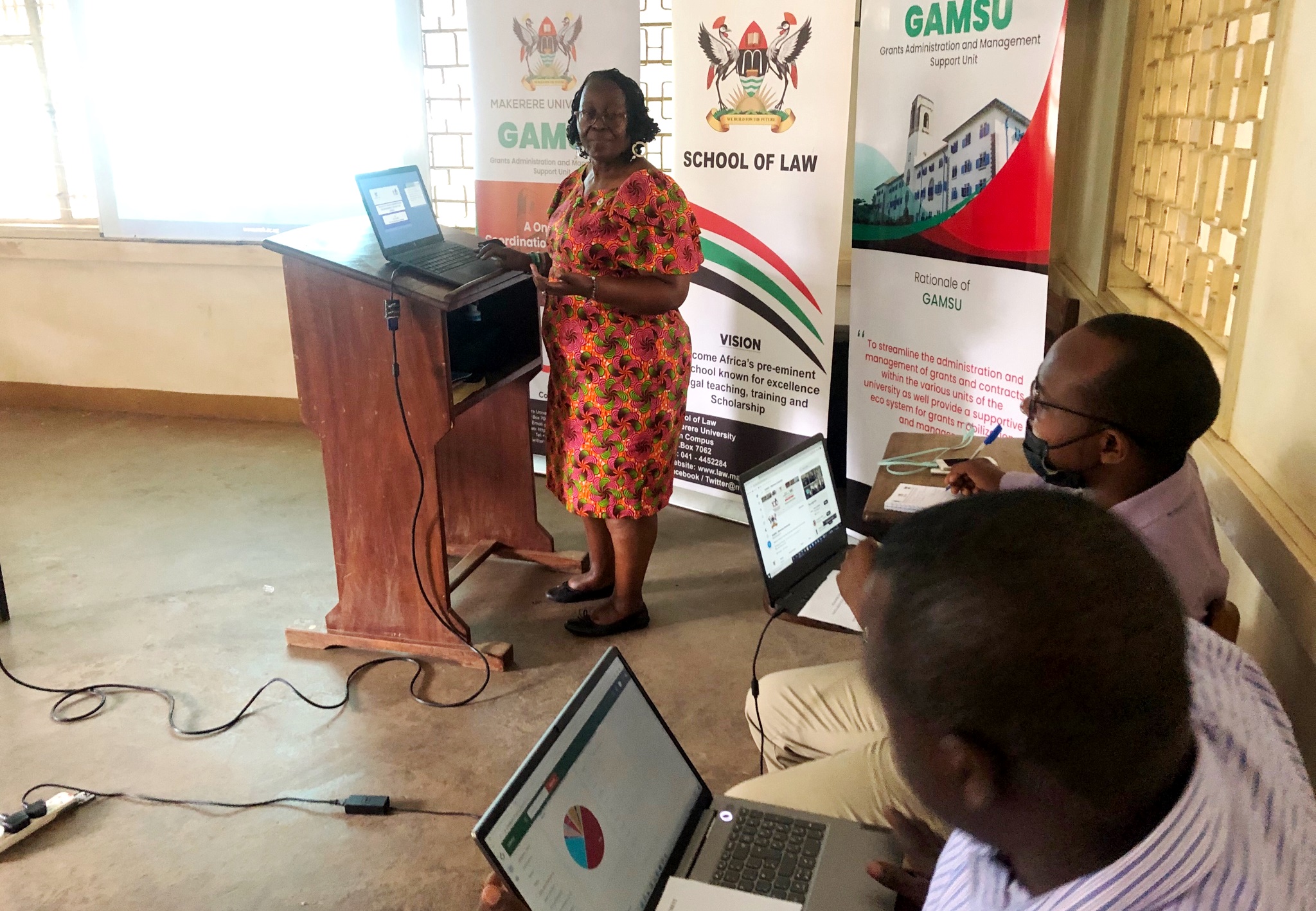 L-R: The Head GAMSU, Prof. Grace Bantebya Kyomuhendo, Mr. Laban Lwasa and Mr. Yunusu Musisi at the sensitization on 8th June 2022, School of Law, Makerere University.