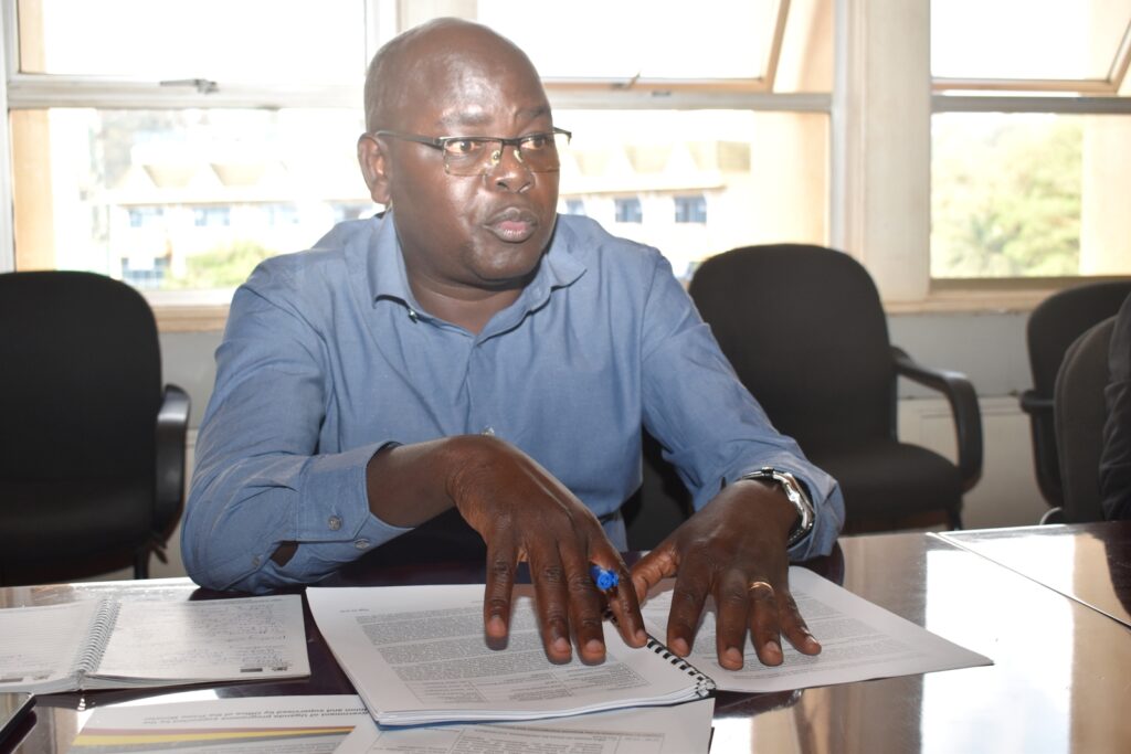 The Makerere University Programme Coordinator, Dr Bernard Obaa presenting the action plan.