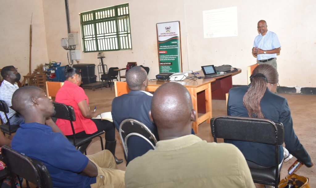 Prof. Phinehas Tukamuhabwa (standing) briefing the Principal about MAKCSID at MUARIK.