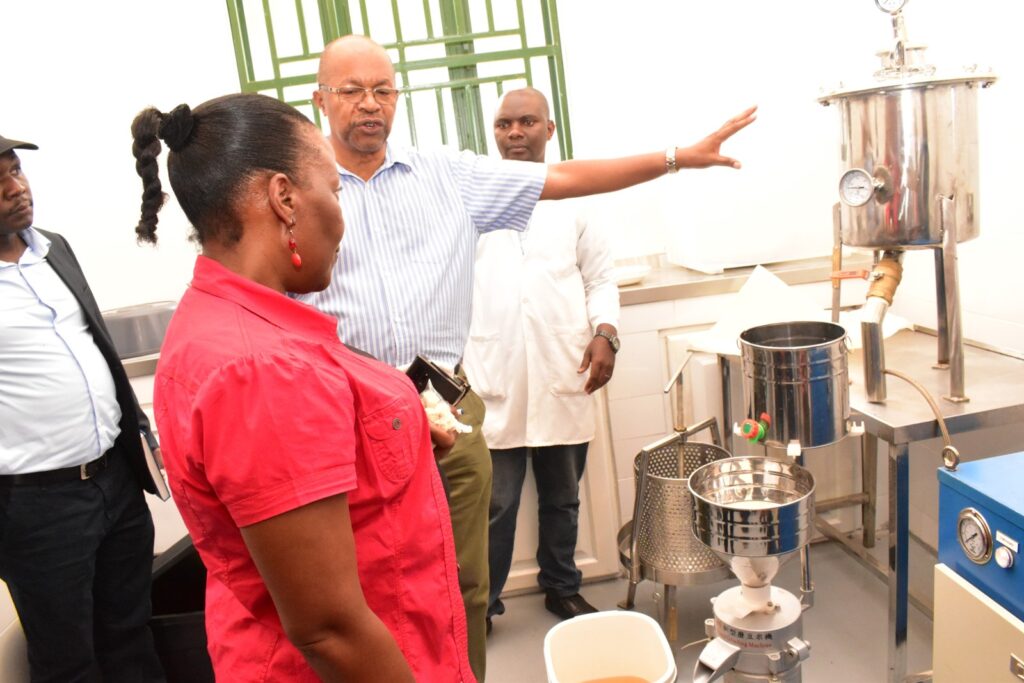 The Principal checking out the soybean milking machine.