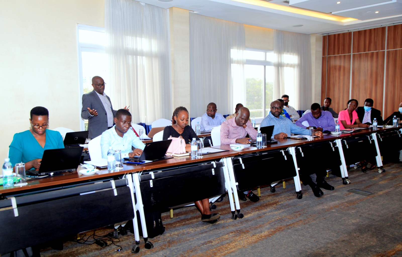 Dr. Revocatus Twinomuhangi, Senior Lecturer and Coordinator of the Makerere University Centre for Climate Change Research and Innovation-MUCCRI (Standing) addresses participants during the Consultation Meeting on 30th June 2022, Golden Tulip Cannan Hotel, Kampala.