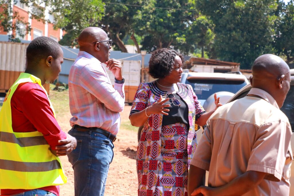 Dean MakSPH, Prof. Wanyenze (2nd R) explains to Dr. Sambisa (2nd L) how the new structure will look like and its importance. in the public health training and research agenda for Uganda. 