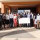 L-R: (Holding the dummy cheque) Dr. Euzobia Baine Mugisha-Director Gender Mainstreaming Directorate, H.E. Zhang Lizhong-Ambassador of People's Republic of China to Uganda and the Vice Chancellor Prof. Barnabas Nawangwe in a group photo with the scholars and some members of staff on 26th July 2022 at Senate Building, Makerere University.