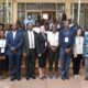 The Deputy Principal, CoNAS, Prof. Juma Kasozi (5th L), Dean School of Physical Sciences, Prof. Michael Owor (4th L), Head Department of Geology and Petroleum Studies, Dr. Arthur Batte (R), PI DRIAR Project, Dr. Sarah Stamps (C) with officials and participants at the opening ceremony on 11th July 2022, Department of Plant Science, Microbiology and Biotechnology Building, College of Natural Sciences (CoNAS), Makerere University.