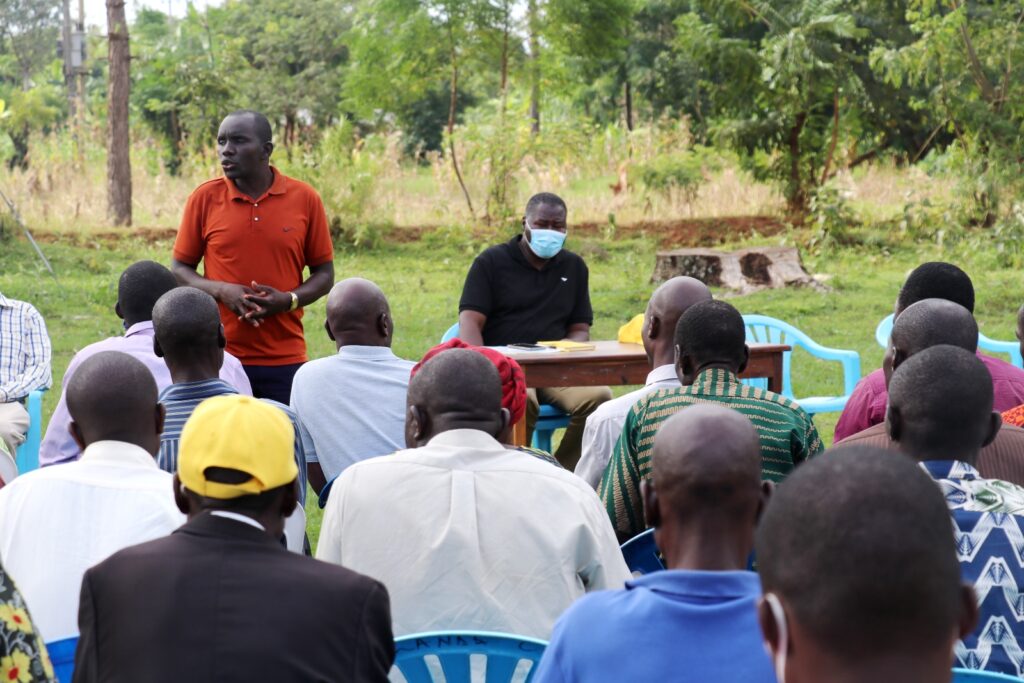 The Executive Director, AFRISA, Mr. Felix Okello making his remarks on AFRISA’s input in the PDM productivity acceleration of households during a parish meeting in Mulanda, Tororo District on 25th June, 2022. In the front with him is the Minister of State for Defence, Hon. Jacob Marksons Oboth-Oboth, who is spearheading the PDM implementation process in Tororo District.