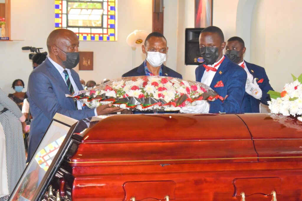 The Deputy Vice Chancellor Academic Affairs (DVCAA), Prof. Umar Kakumba (2nd L) and Deputy Vice Chancellor Finance and Administration (DVCFA), Prof. Henry Alinaitwe (L) lay a wreath on the casket of Prof. Christine Dranzoa. 