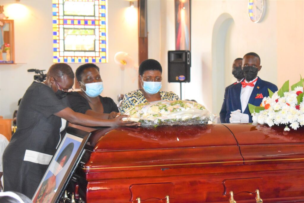 Dr. Sarah Nalule (C) and staff of the Wildlife and Aquatic Resources Management (WARM) Department pay their last respects to Prof. Christine Dranzoa.