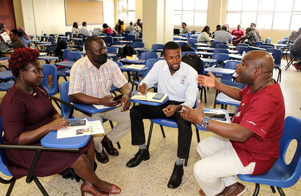 Participants in their groups discussing the population survey and alternatives. 