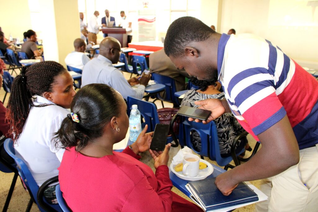 Some participants being aided to carry out the survey using their smart phones.