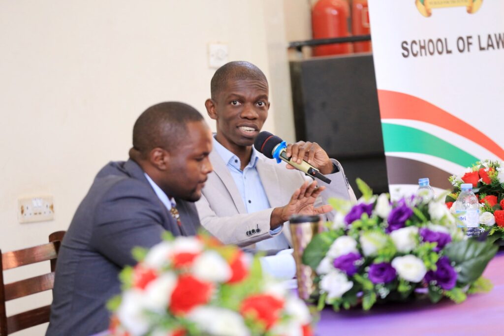 Mr. Robert Kirunda (Right) discusses The Legal Risks of Cryptocurrency On State Sovereignty; A Case Study of Uganda’. Left is Dr. Busingye Kabumba, Senior Lecturer, School of Law. 