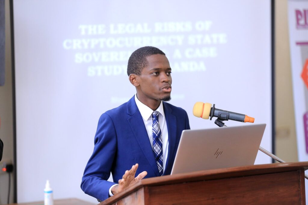 Joshua Kingdom presents the joint paper The Legal Risks of Cryptocurrency On State Sovereignty; A Case Study of Uganda’. Photo credit: MLJ.