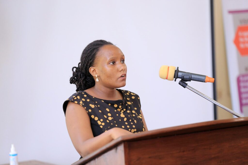 Ruth Muhawe presents her paper ‘The Human Rights Implications of Uganda’s Borrowing’ . Photo credit: MLJ.