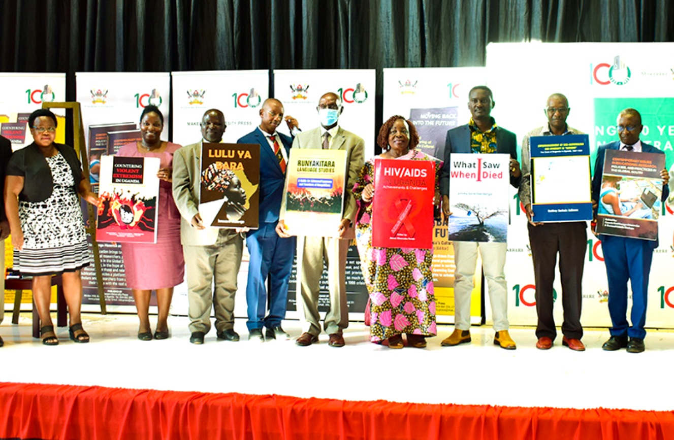 The Managing Editor, Makerere University Press (MUP), Dr. Samuel Siminyu (Right) with some of the authors and CHUSS Staff at the Book Launch on 28th June 2022, Yusuf Lule Central Teaching Facility Auditorium, Makerere University.