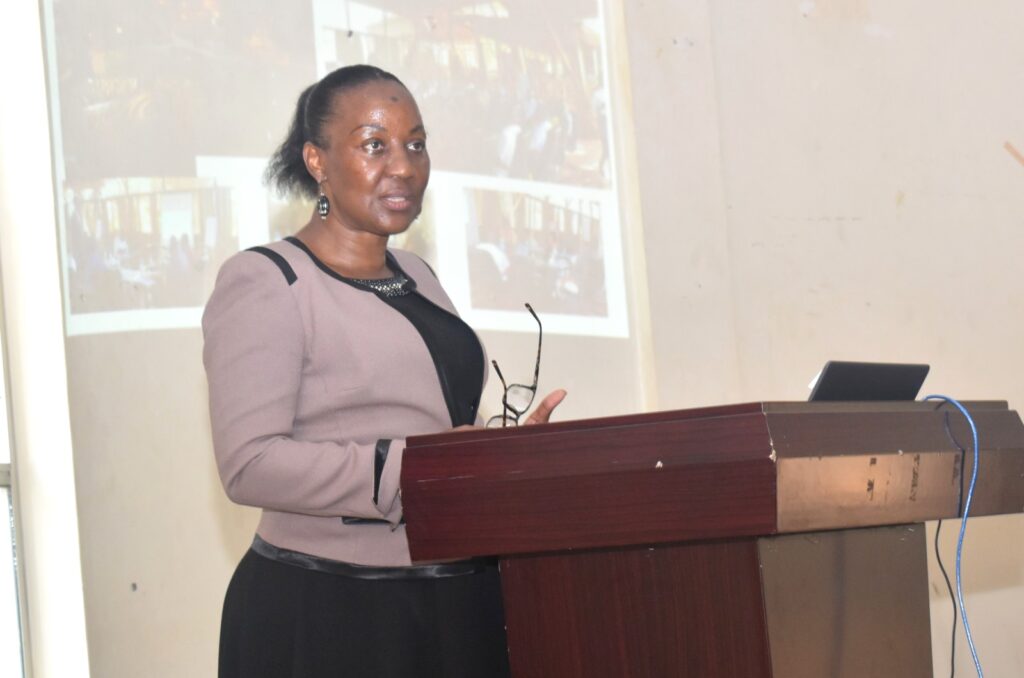 The Principal, CAES, Prof. Gorettie Nabanoga presenting the Pact.