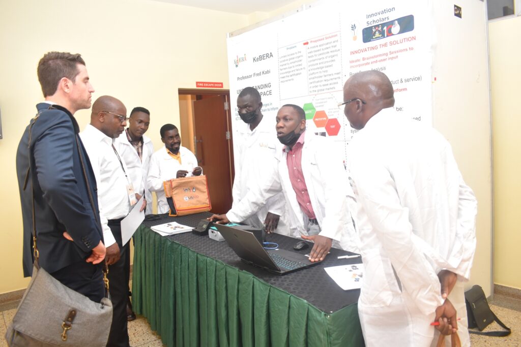 Prof. Fred Kabi's team explaining how the Kebera Organic App detects contaminants in food.