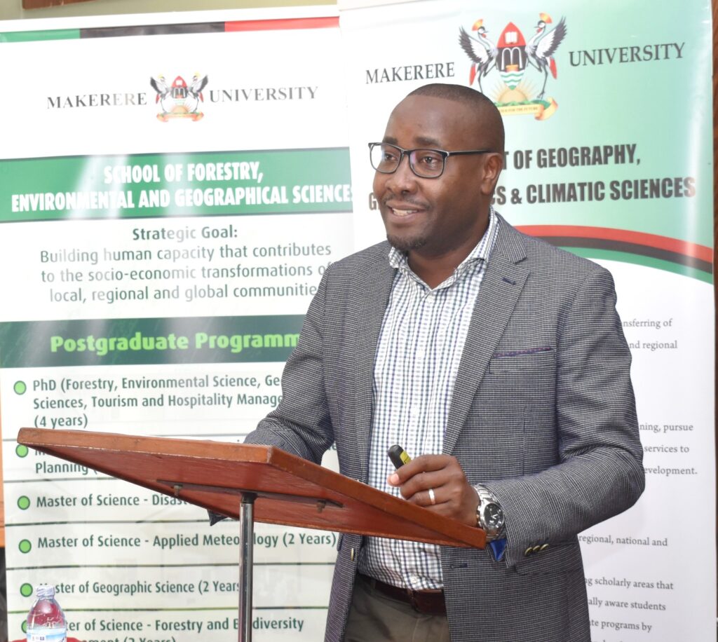 The Head, Department of Geography, Geo-informatics and Climatic Sciences, Prof. Frank Mugagga briefing participants on the review process.