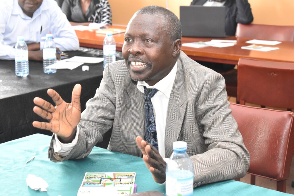 Prof. Fredrick Tumwine commenting on the revisions.