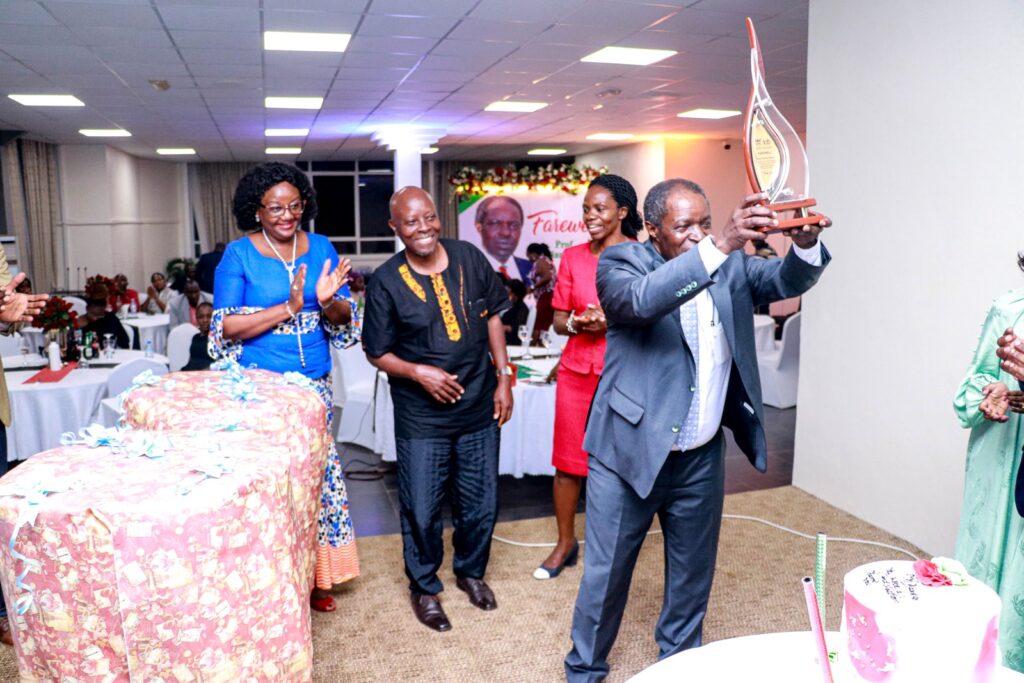 Prof. Bazeyo (R) holds up his plaque as L-R: Prof. Rhoda Wanyenze, Assoc. Prof. John C. Ssempebwa and Assoc. Prof. Esther Buregyeya witness.