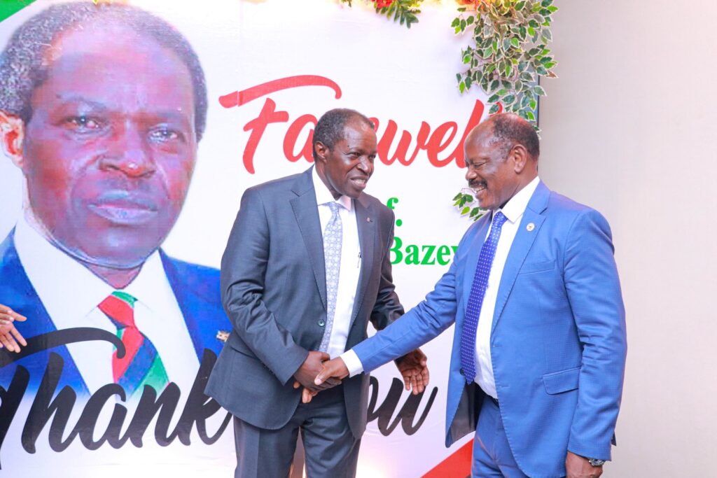 Makerere University Vice Chancellor Professor Barnabas Nawangwe shakes hands with Prof Bazeyo at MakSPH Dinner to bid him farewell.