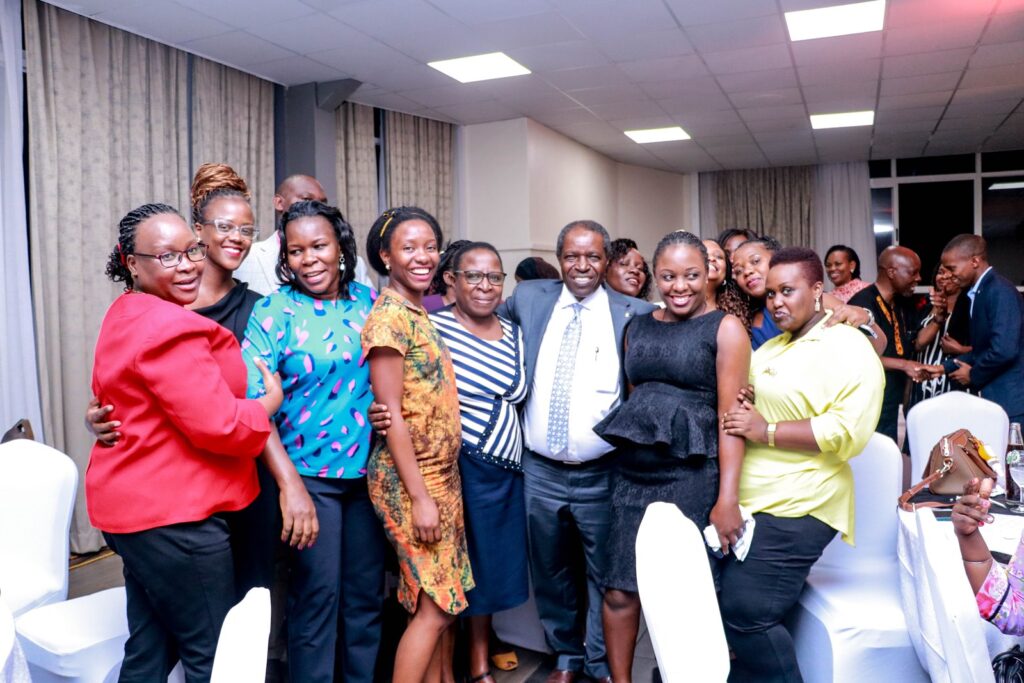 Prof. William Bazeyo poses for a photo with staff at MakSPH.