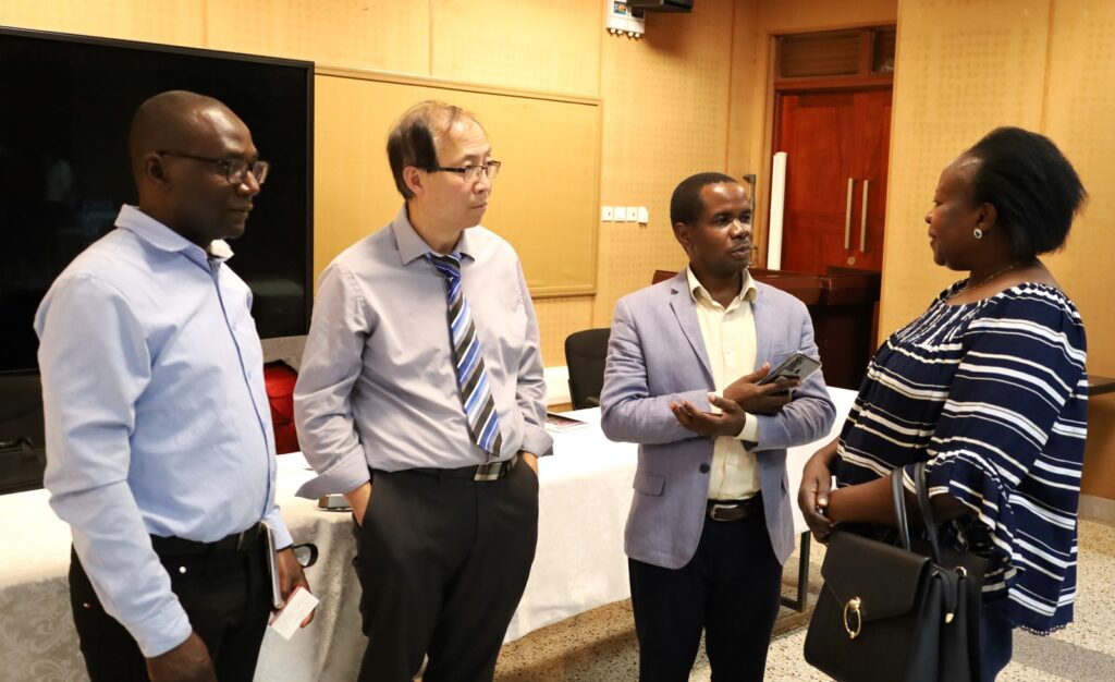 Dr. Ivan Lukanda (L) and Dr. Ebila Florence (R) interact with Prof Wing-Kai and Dr. Daniel Ddumba after the meeting.