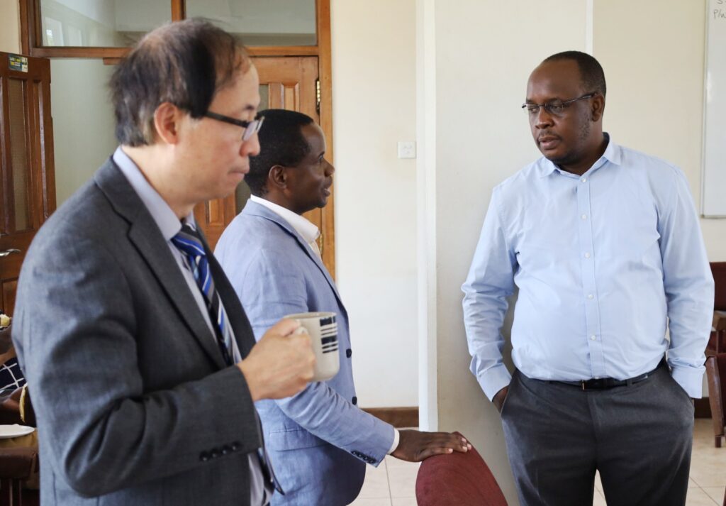 Prof. Wing-Kai  and Dr. Daniel Ddumba,  interact with CoCIS Ag. Deputy Principal  Dr. Peter Nabende.