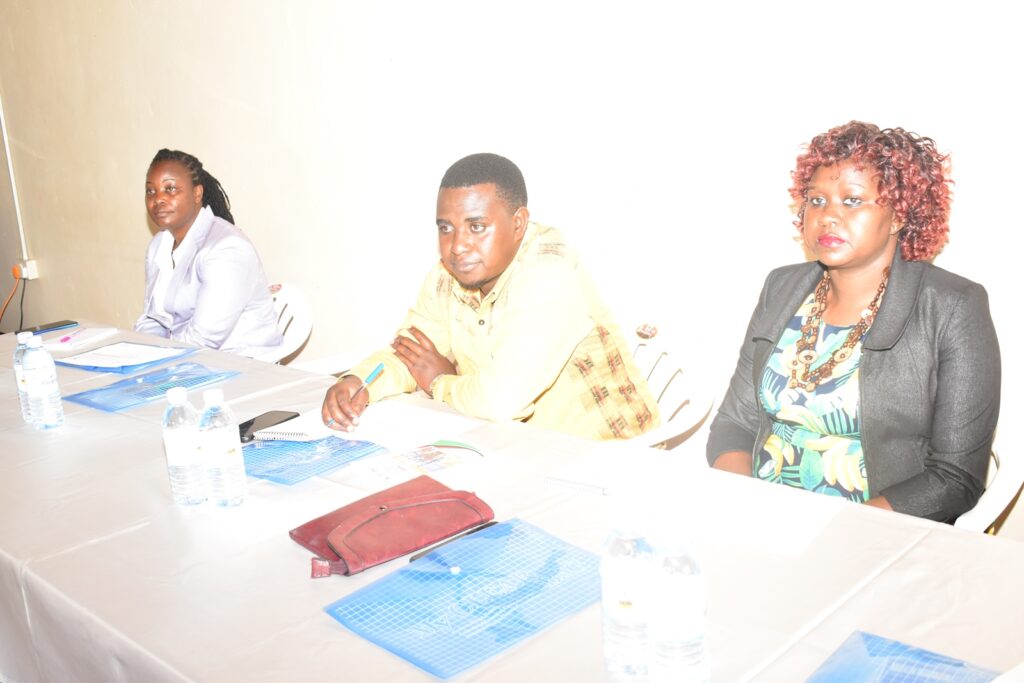 The Warden Research and Ecological Monitoring, Kibale Conservation area, Ms. Dorothy Kirumira (L) together with representatives from Mak-RIF, Ms. Evelyne B. Nyachwo (R) and Mr. Aziz Agaba at the project dissemination workshop.
