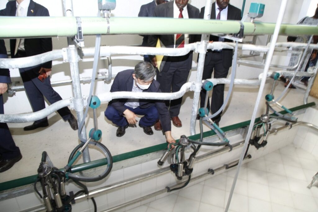 Officials inspect some of the parts in the state-of-the-art milking parlour at the facility.