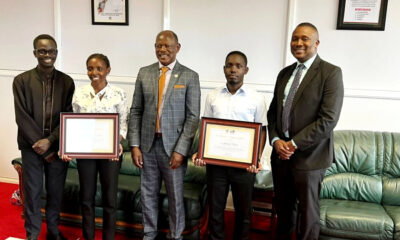 The Vice Chancellor-Professor Barnabas Nawangwe (Centre) with Mak Moot Society Patron-Dr. Daniel Ruhweza (Right), SoL Alumni & Team Coach-Mr. David Kasibante (Left) and winners: Ms. Kevin Nakimbugwe (2nd Left) and Mr. Edwin Sabiiti (2nd Right) with their certificates of recognition on 4th August 2022, Frank Kalimuzo Central Teaching Facility, Makerere University.