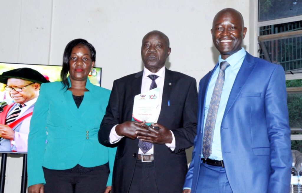 One of the retirees, Prof. Bareeba Felix after receiving an award in recognition of his service to Makerere University.