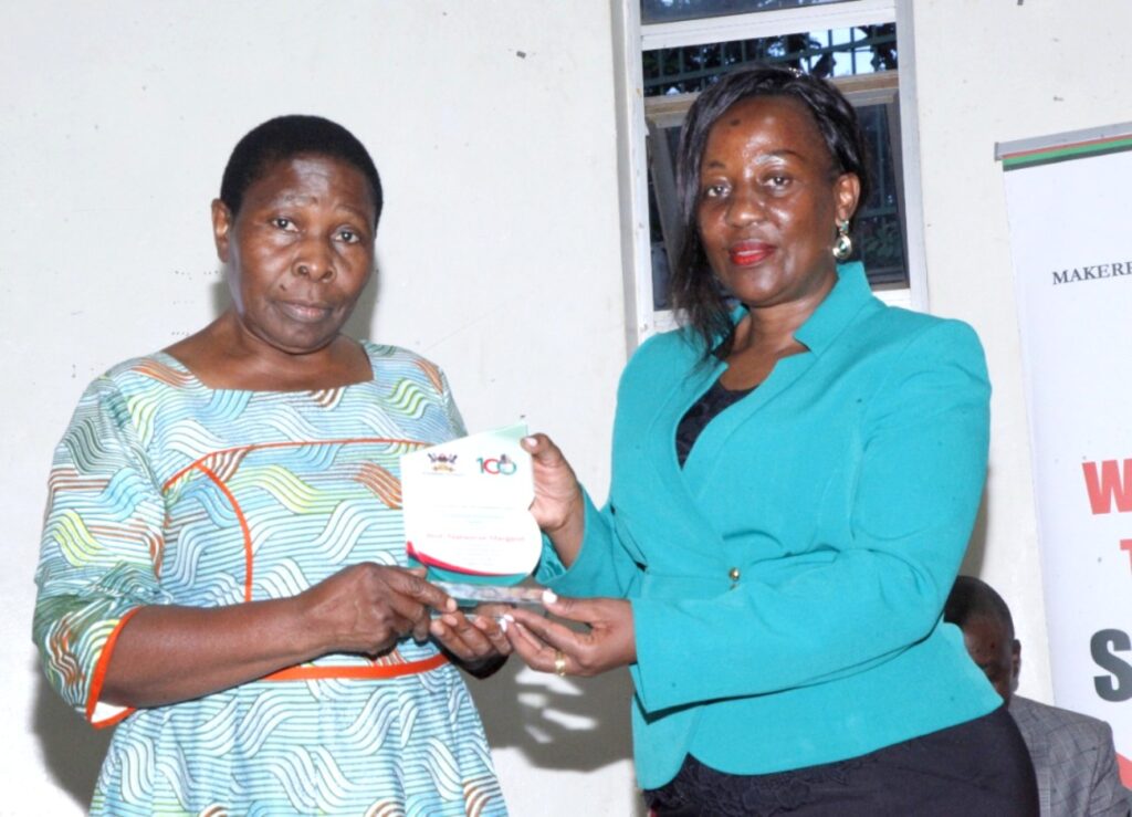 Prof. Nabasirye Margaret receiving her award from the Principal, CAES.