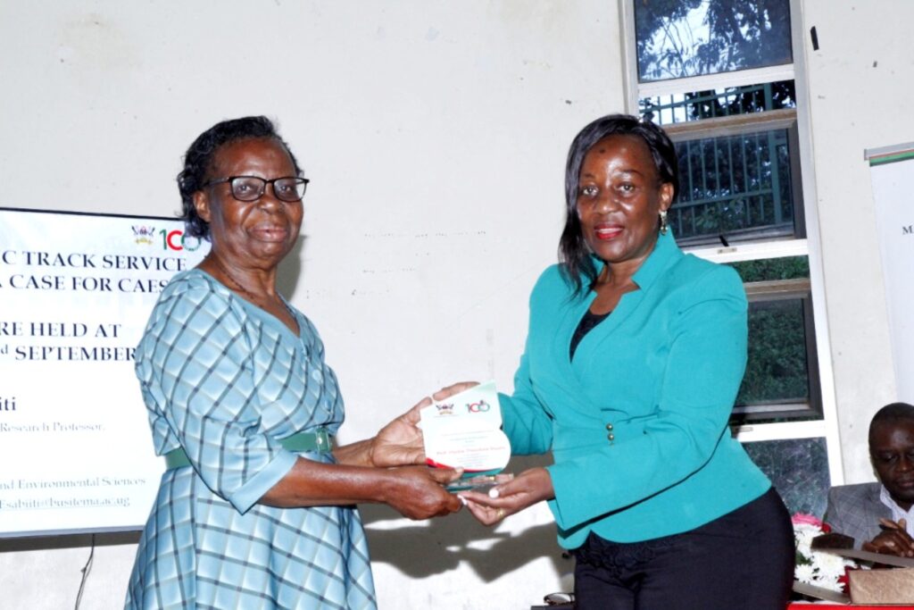 Prof. Theodora Shuwu Hyuha receiving an award from the Principal CAES. Prof. Hyuha retired from University service this year - 2022.