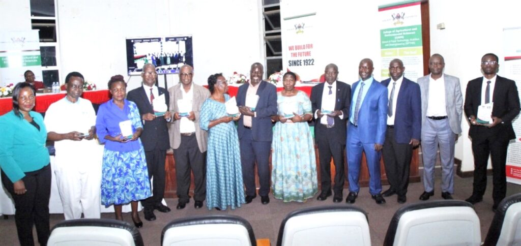 Retired members of staff after receiving their awards in recognition of their service to Makerere.