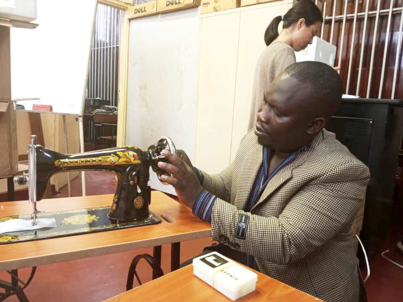 Mr. Joseph Watuleke, the CLL head tests one of the machines yesterday September 1, 2022 at the College, Makerere University.