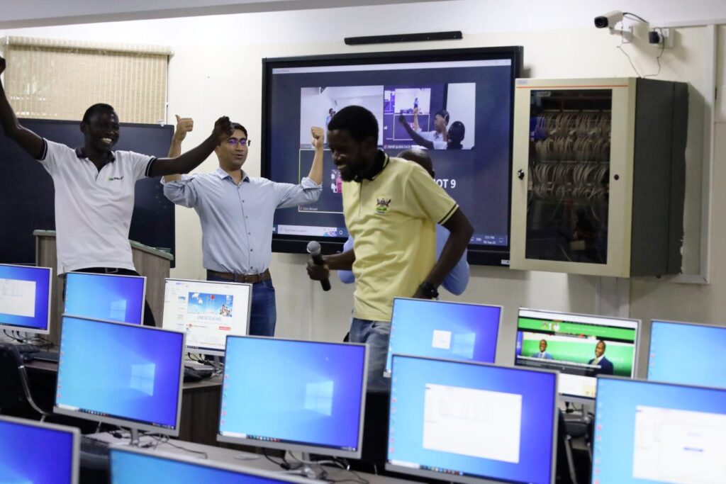 Badru Ssekumba, Hassan Adeel, Nicholas Betungye and Baluku Herbert jubilate after completing the last step of connectivity for the Smart Classroom on 2nd September 2022 at Makerere University.