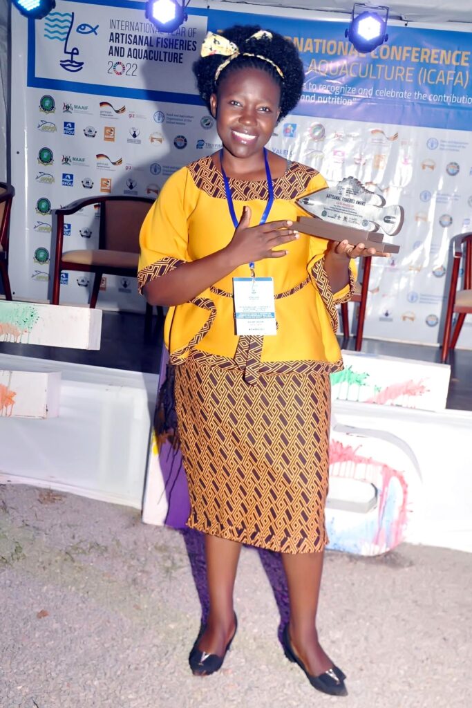 Julliet Nafula Ogubi with her award at ICAFA.